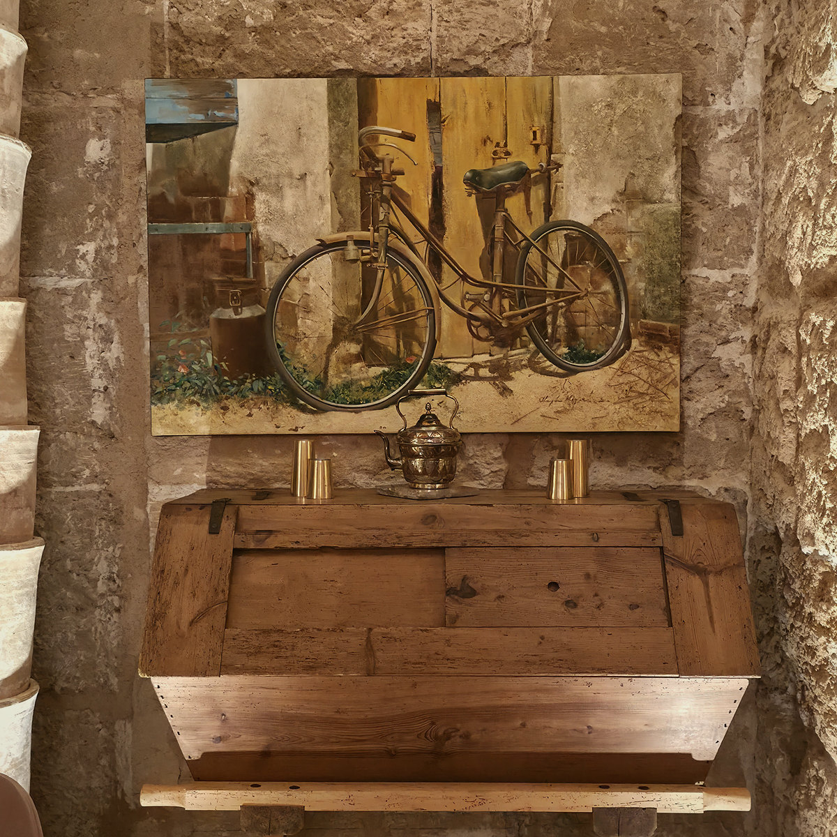 An antique wooden chest beneath a painting at Glòria de Sant Jaume