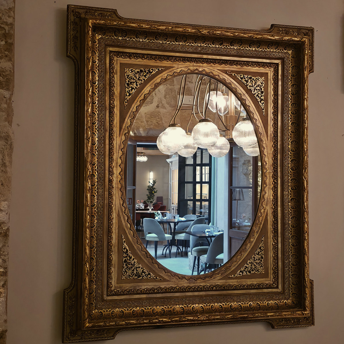 A gilded antique mirror at Glòria de Sant Jaume