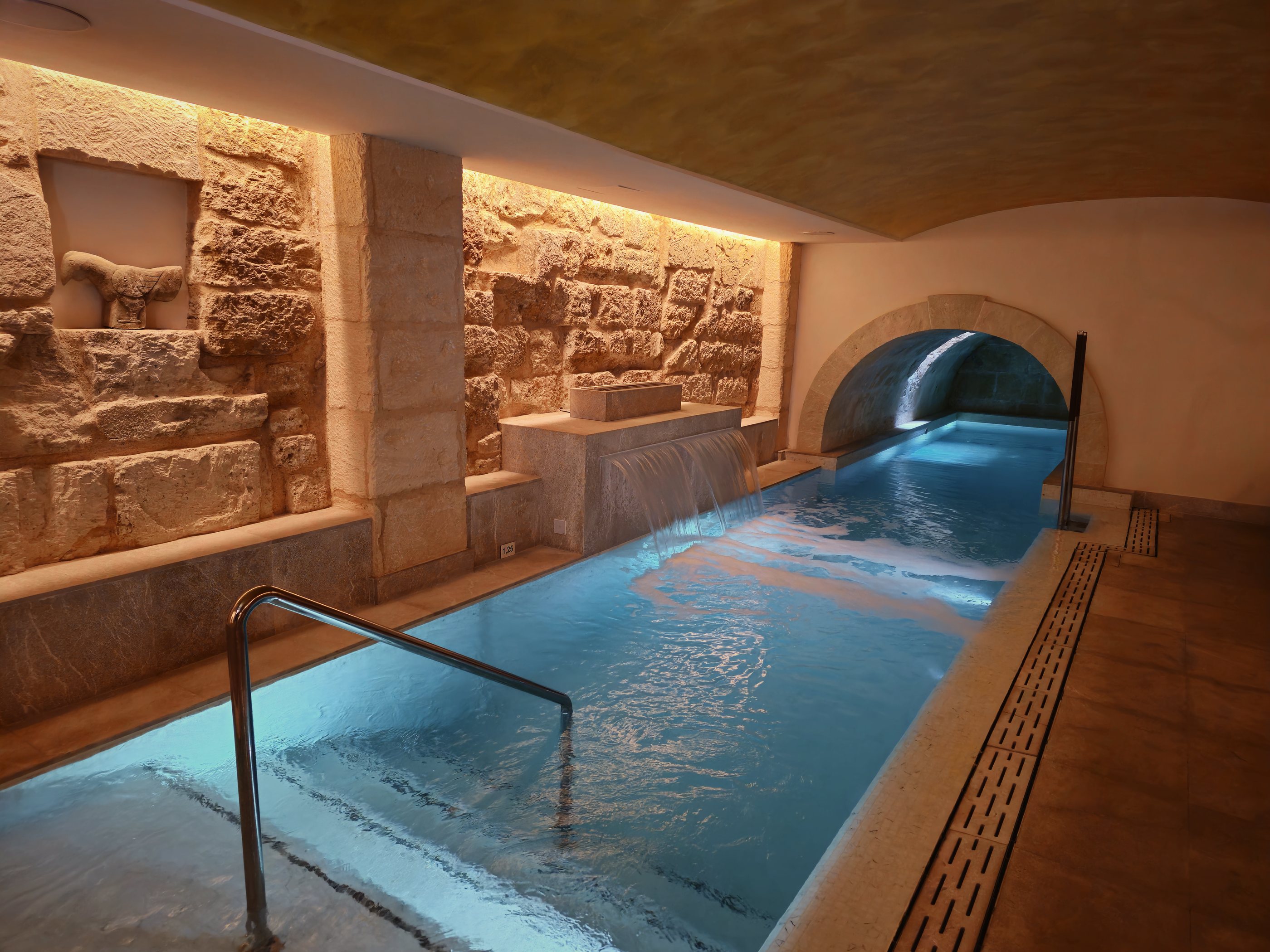 The heated pool in the old cistern beneath Glòria, spa in Palma
