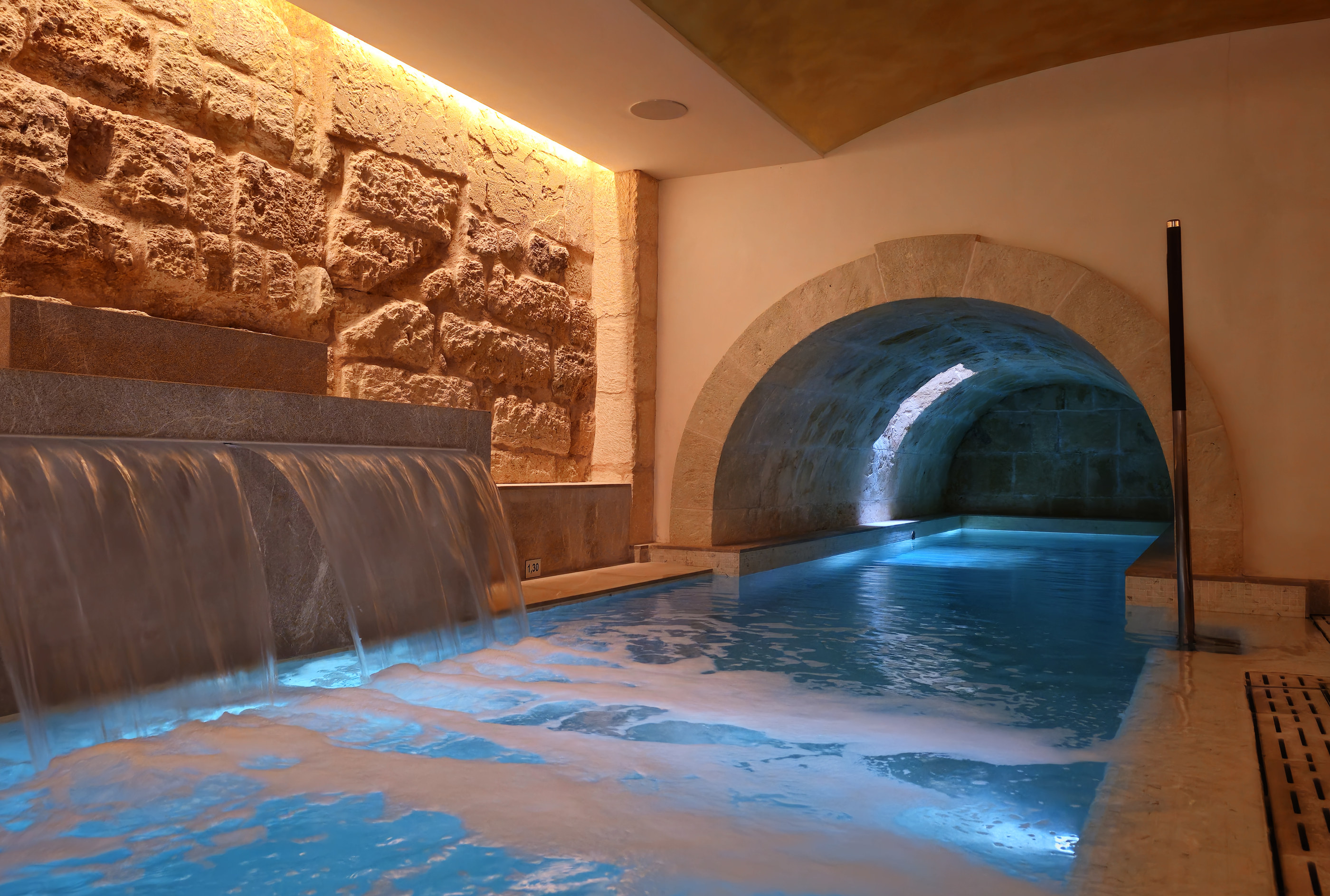 Heated pool in the historic cistern beneath Hotel Glòria de Sant Jaume, Palma