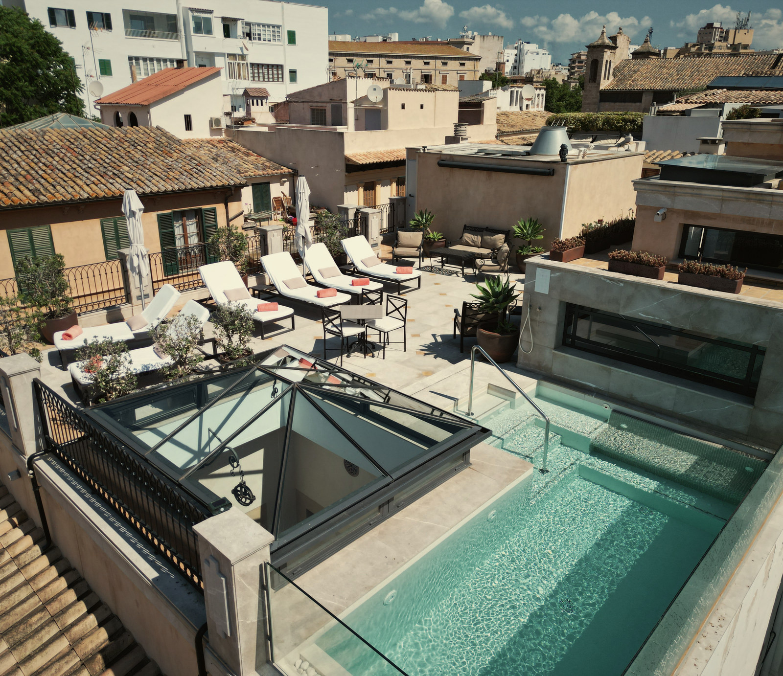 The rooftop terrace and pool above Palma old town at Glòria